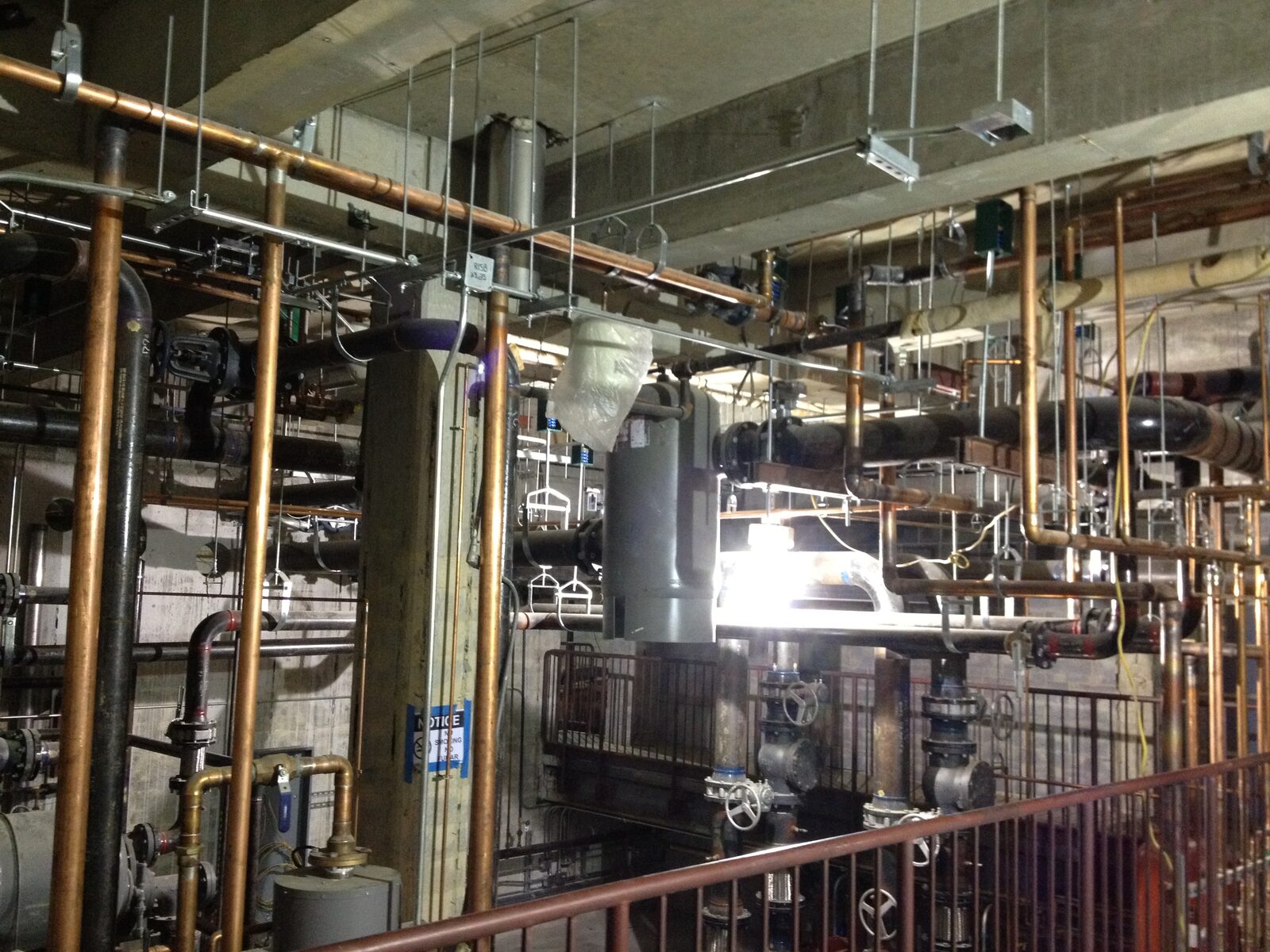 Placeholder photo of a commercial mechanical room with piping and equipment